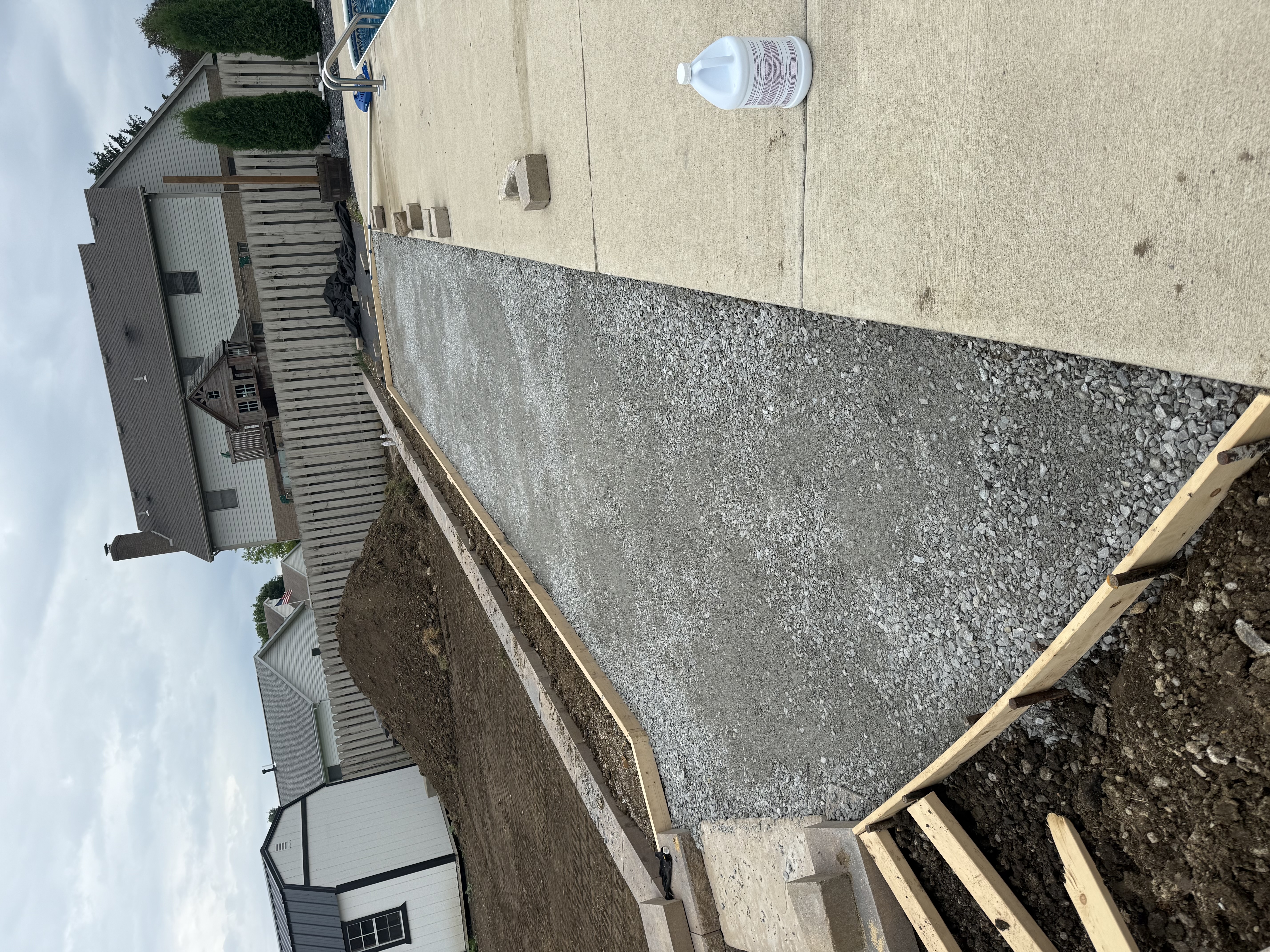 Concrete and gravel foundation work in progress