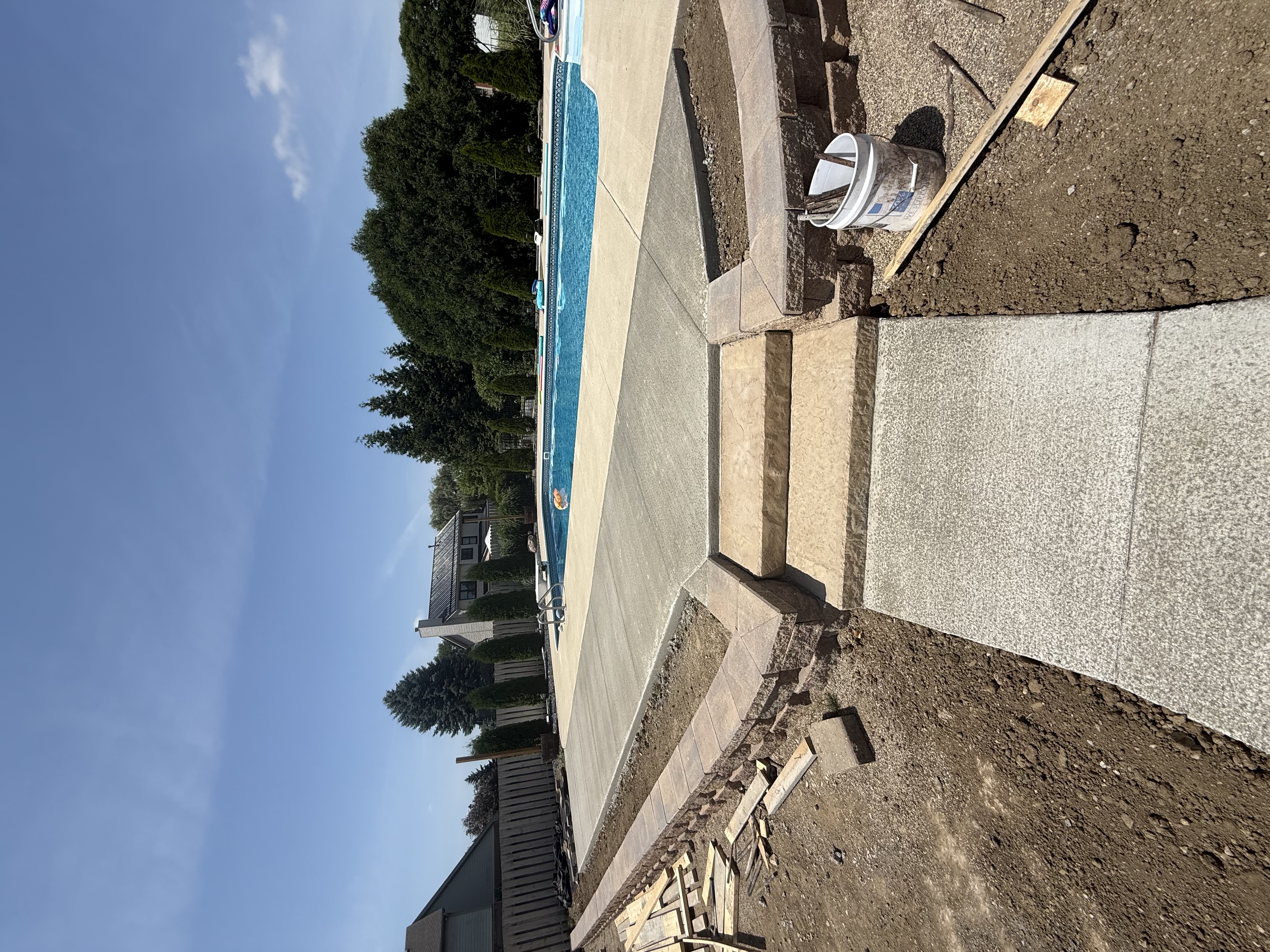 Pool and concrete patio construction in progress